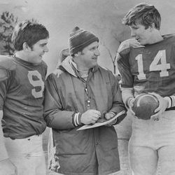 BYU head football coach LaVell Edwards talks with Jeff Nilsson and Gifford Nielsen on April 10, 1976.
