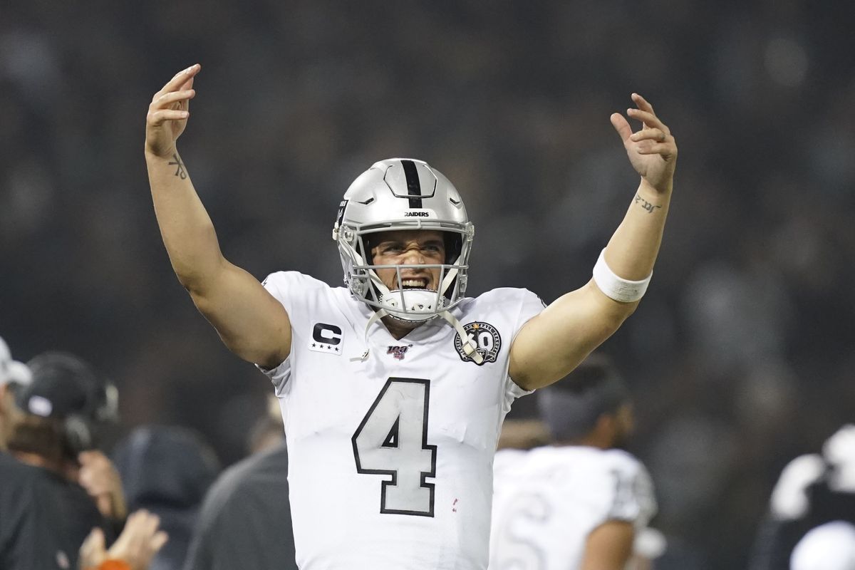Oakland Raiders quarterback Derek Carr interacts with the fans during the fourth quarter against the Los Angeles Chargers at Oakland Coliseum.