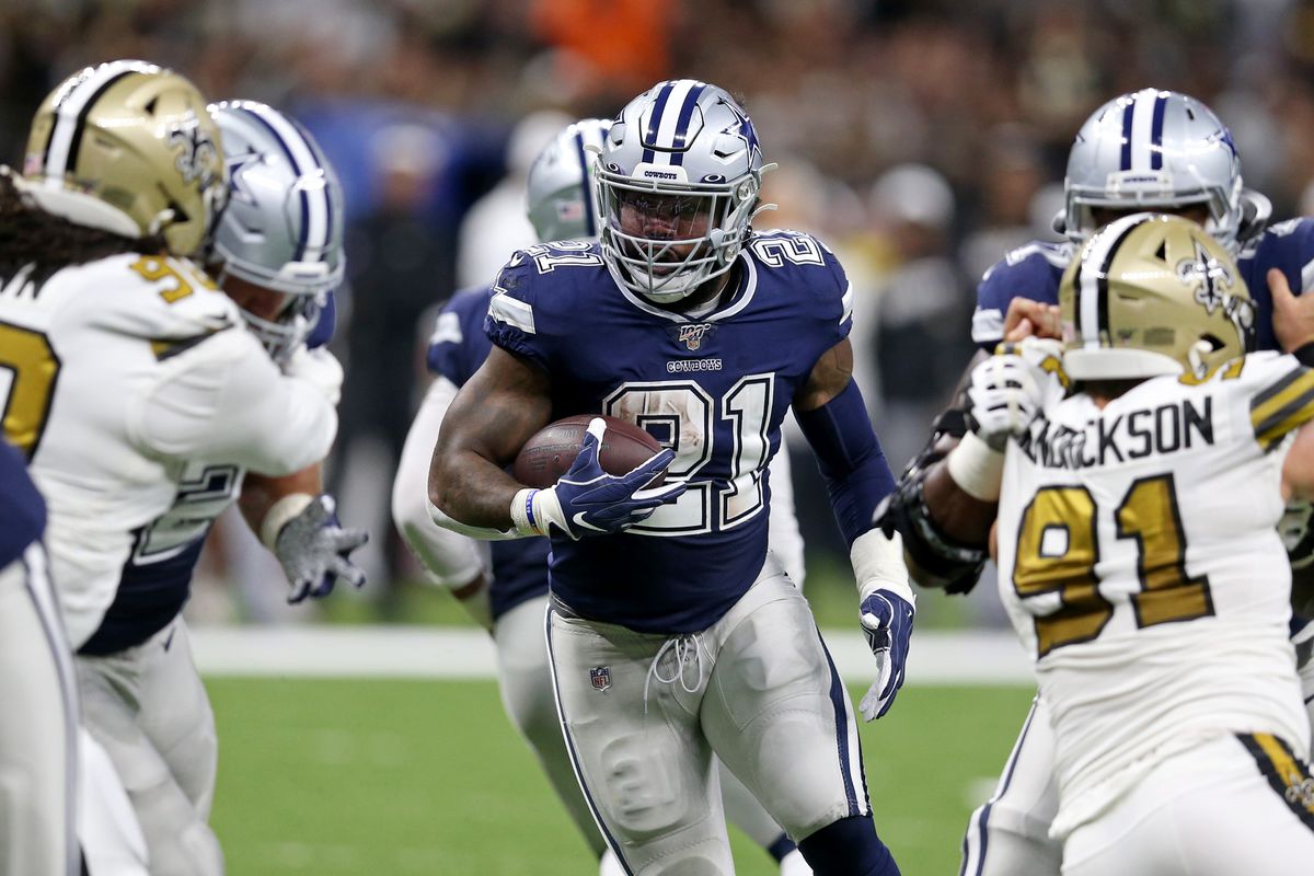 Dallas Cowboys running back Ezekiel Elliott runs the football in the first quarter against the New Orleans Saints at the Mercedes-Benz Superdome.