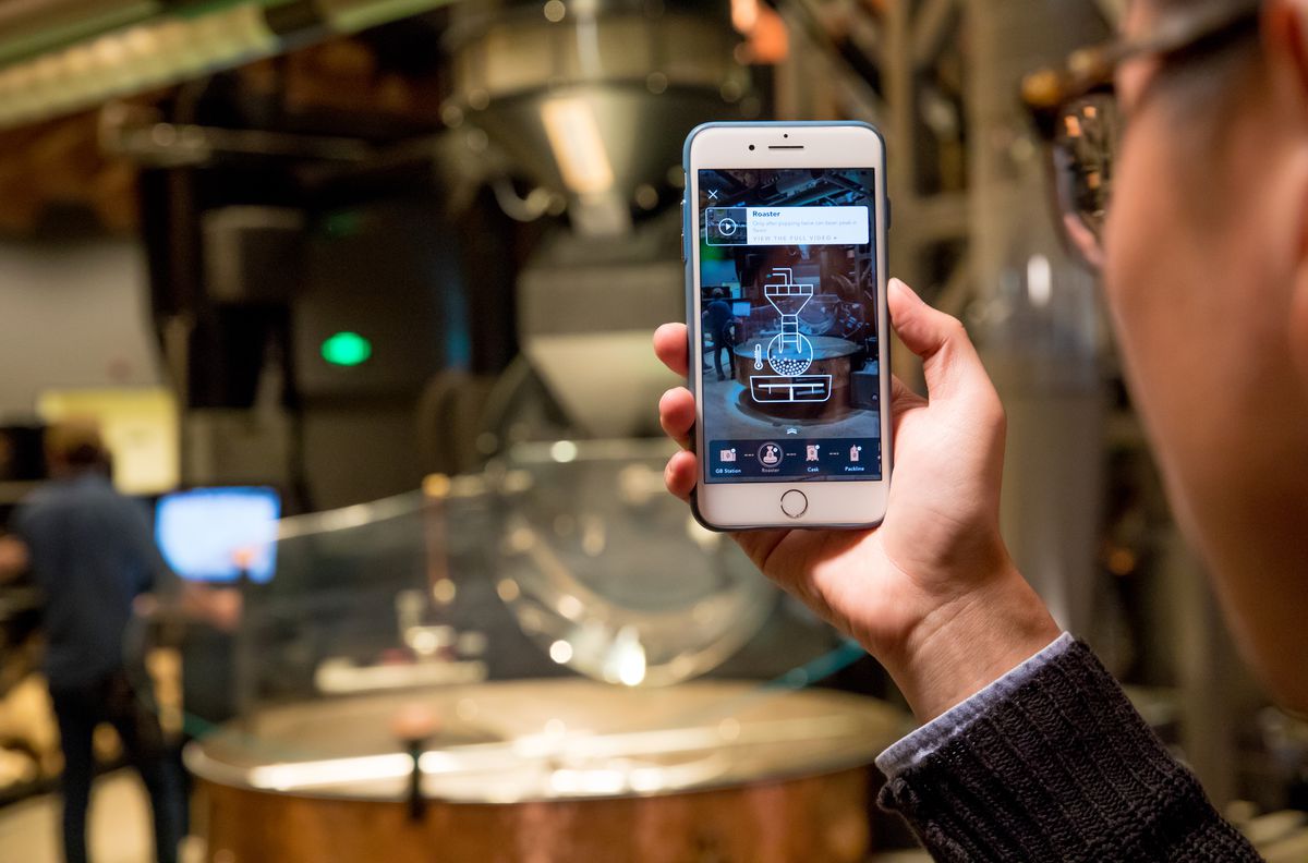 A customer uses the augmented reality feature at the Shanghai Roastery.