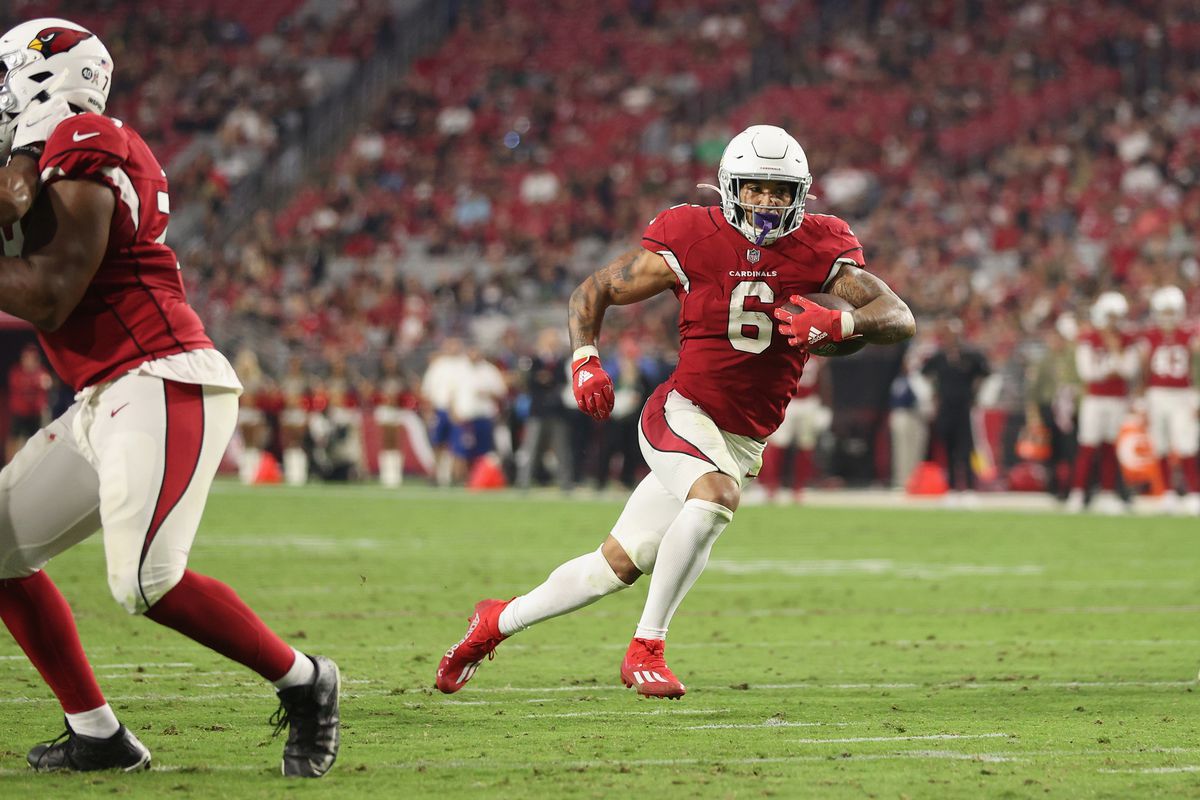 Running back James Conner #6 of the Arizona Cardinals scores on a 11-yard rushing touchdown against the Carolina Panthers during the fourth quarter of the NFL game at State Farm Stadium on November 14, 2021 in Glendale, Arizona. The Panthers defeated the Cardinals 34-10.