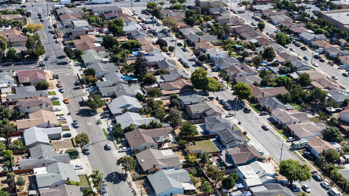 An overhead view of a neighborhood filled with single-family homes.