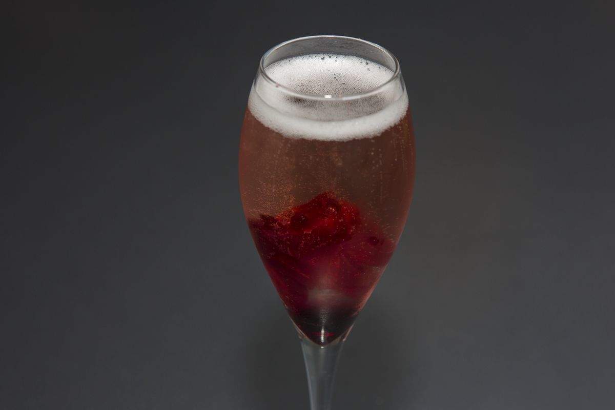 A red and bubbly cocktail.