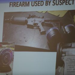 The firearm used by the shooter Connor Betts, 22, is projected on a screen during a press conference Sunday, Aug. 4, 2019, about a mass shooting that left left multiple people dead and 26 injured along the 400 block of E. Fifth Street, in Dayton, Ohio. (Albert Cesare/The Cincinnati Enquirer via AP)