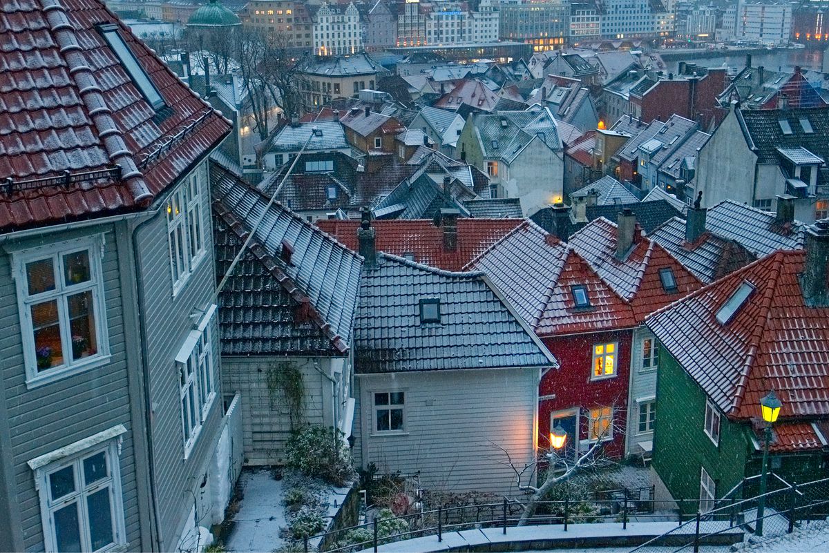 Aerial shot of snow on rooftops in Bergen, Norway.
