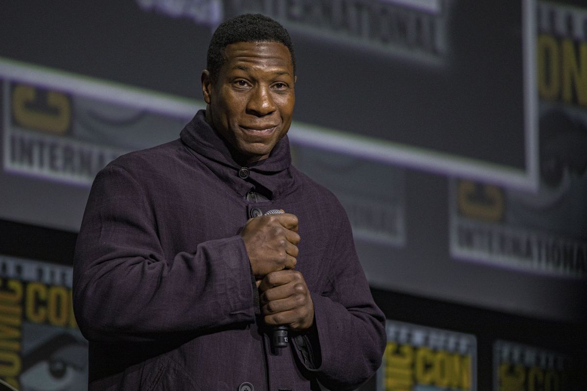 SAN DIEGO, CALIFORNIA - JULY 23: Jonathan Majors speaks onstage at the Marvel Cinematic Universe Mega-Panel during 2022 Comic-Con International Day 3 at San Diego Convention Center on July 23, 2022 in San Diego, California.