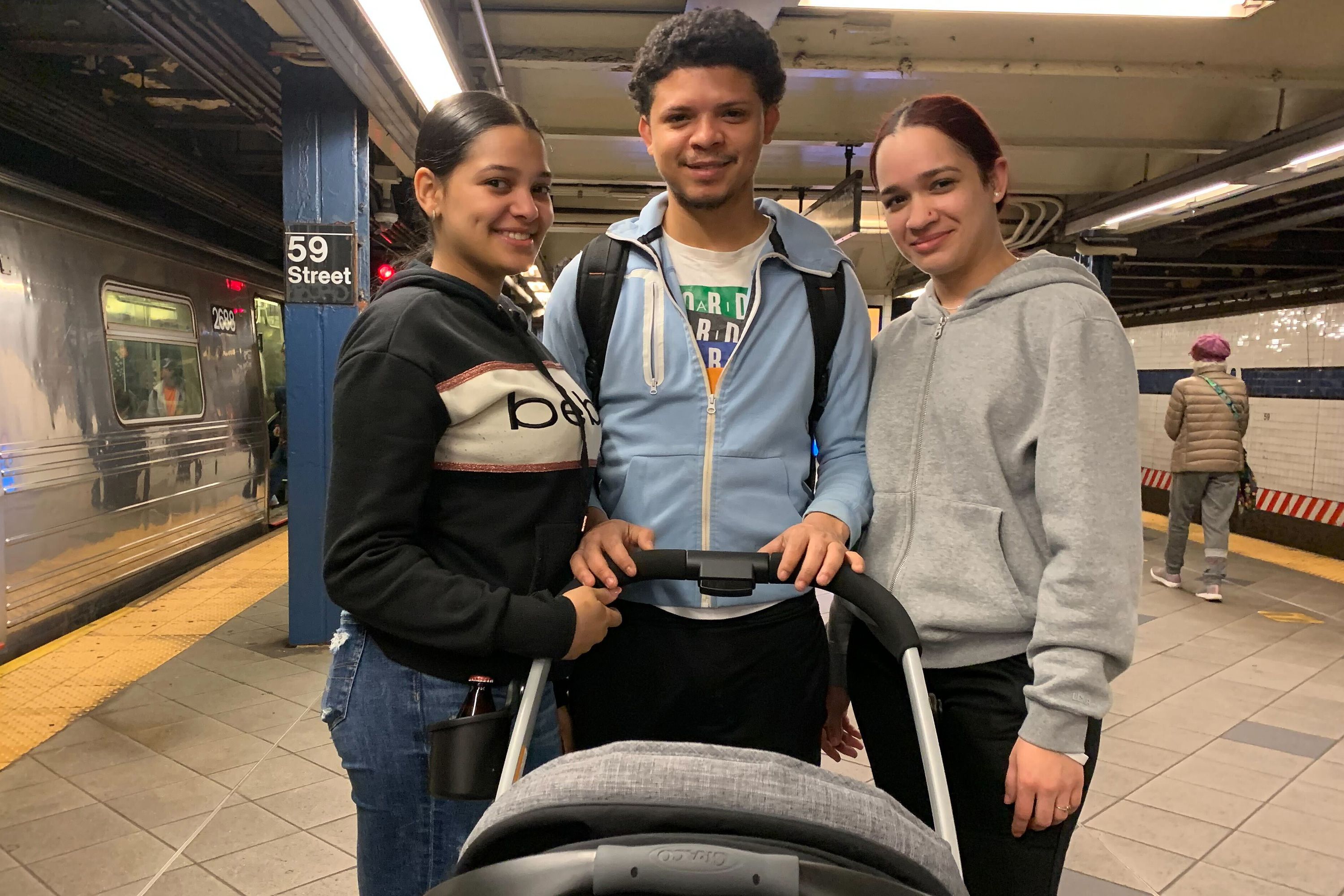 Genesis Diaz, left, her boyfriend Eliesel Perez and friend Solanyi Polanco spoke at 59th Street-Columbus Circle about avoiding urine-soaked elevators, May 5, 2023.