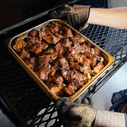 In the process, the burnt ends baste in 18th & Vine's "secret sauce" until the bark caramelizes.