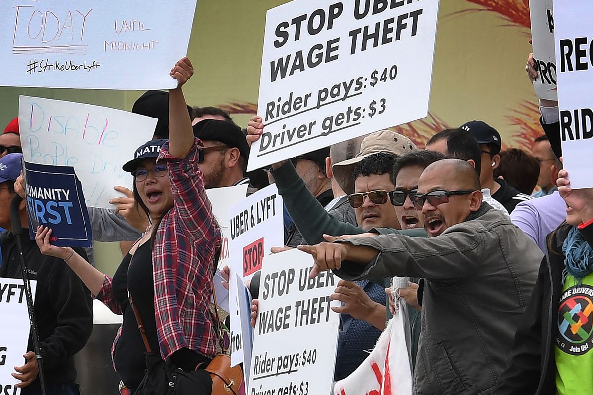 Rideshare drivers for Uber and Lyft stage a strike and protest at the LAX International Airport, over what they say are unfair wages in Los Angeles, California on May 8, 2019.