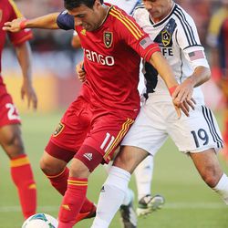 Real Salt Lake midfielder Javier Morales (11) keeps the ball form Los Angeles Galaxy midfielder Landon Donovan (10) during MLS action in Sandy Saturday, June 8, 2013.
