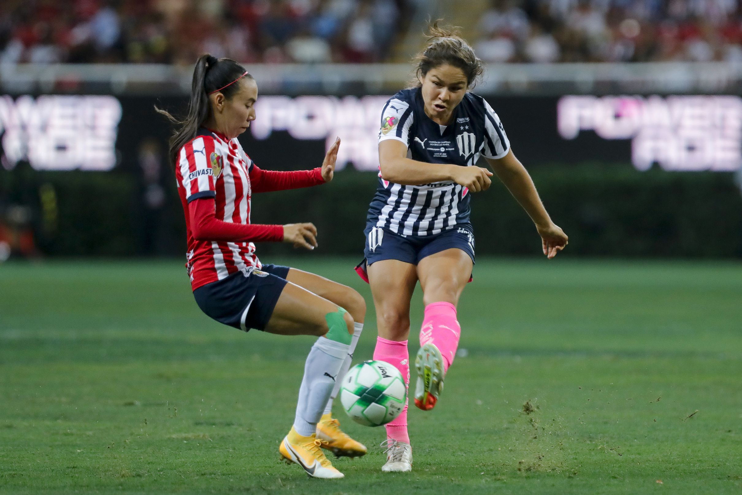 Gabriela Valenzuela of Chivas fights for the ball with Valeria Valdez of Monterrey during the final first leg match between Chivas and Monterrey as part of Campeon de Campeones 2022 Liga MX Femenil at Akron Stadium on May 27, 2022 in Zapopan, Mexico.
