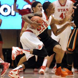 Utah Utes guard Delon Wright (55) drives to the basket as Oregon State Beavers guard Malcolm Duvivier (11) defends during a game at the Jon M. Huntsman Center on Saturday, Jan. 4, 2014.