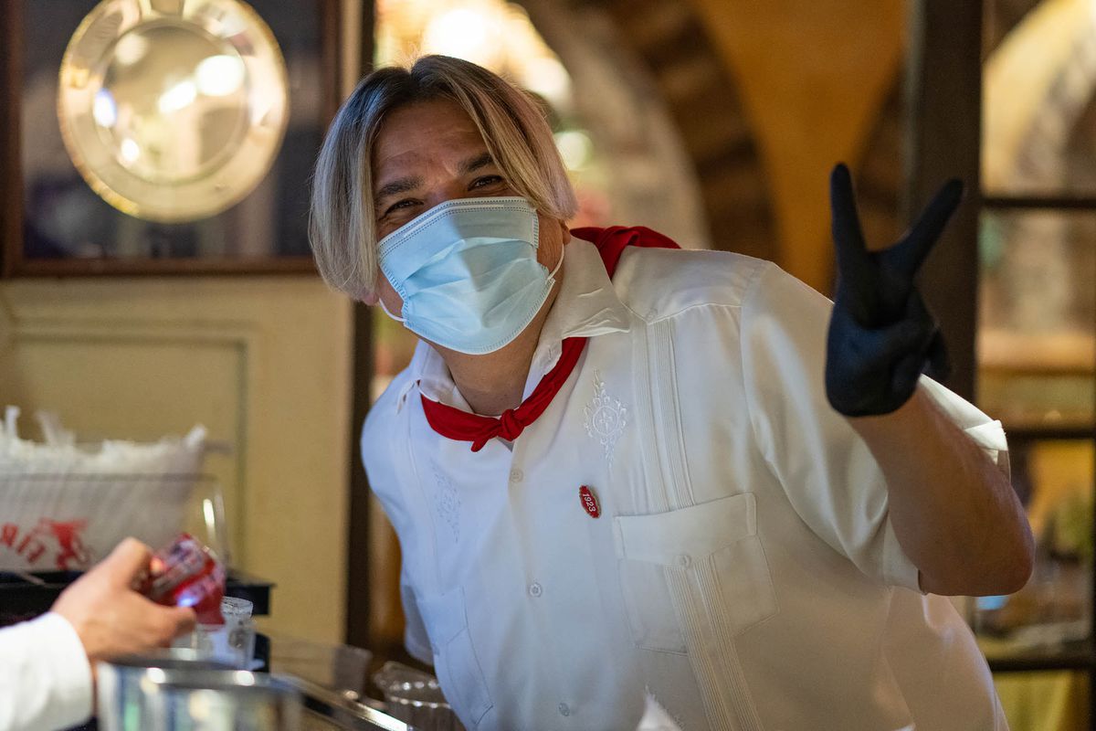 A masked El Cholo restaurant employee in Los Angeles.