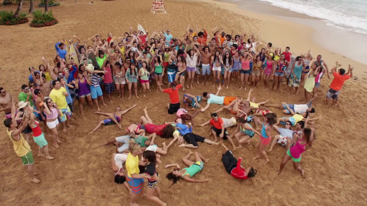 The cast of Teen Beach Movie in the middle of a dance number