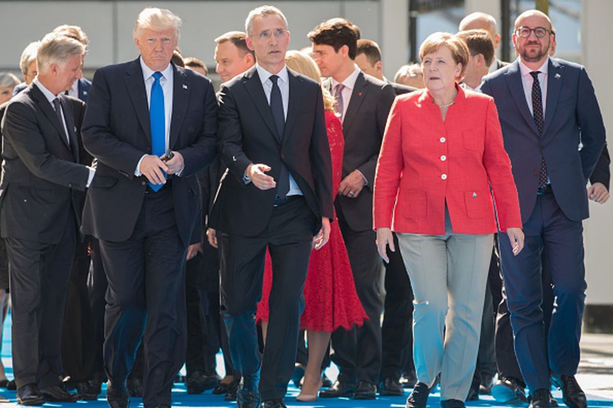 US President Donald Trump, NATO Secretary General Jens Stoltenberg, Chancellor Angela Merkel, and Belgian Prime Minister Charles Michel arrive in May 2017 for the unveiling ceremony of the new NATO headquarters in Brussels.