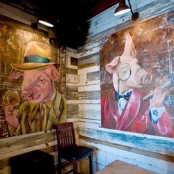 Whimsical porcine art graces the walls throughout