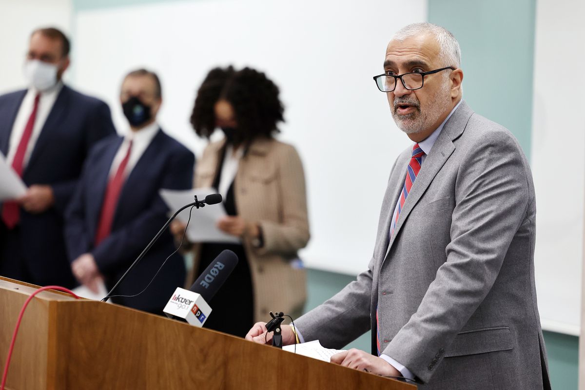 Salt Lake County District Attorney Sim Gill, right, speaks to reporters as prosecutors and defense attorneys gather at the Salt Lake County District Attorney’s Office building to denounce what they say is a bad faith attempt to repeal bail reform by some legislators in Salt Lake City on Monday, March 1, 2021.