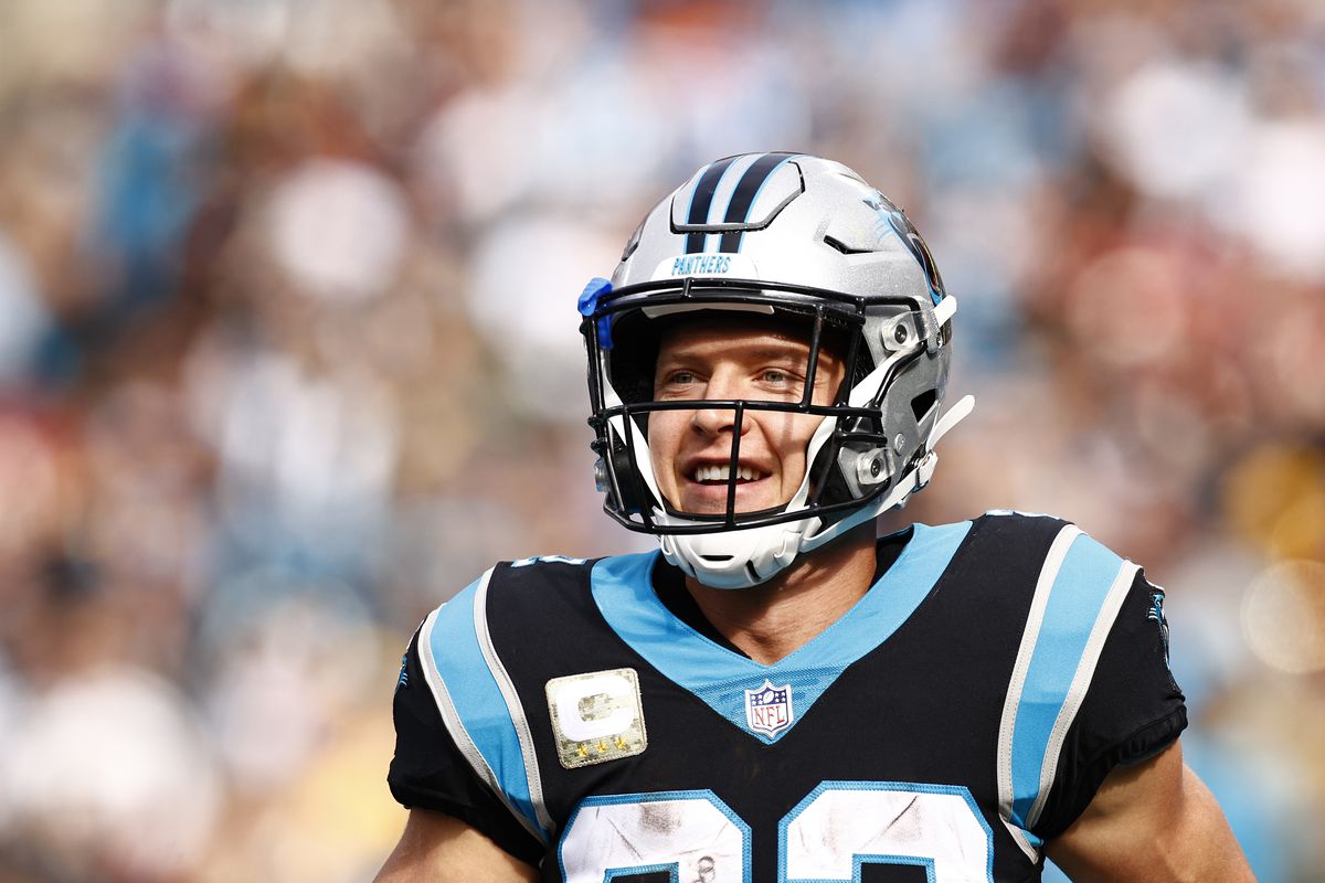 Christian McCaffrey #22 of the Carolina Panthers looks on during the first half of their game against the Washington Football Team at Bank of America Stadium on November 21, 2021 in Charlotte, North Carolina.