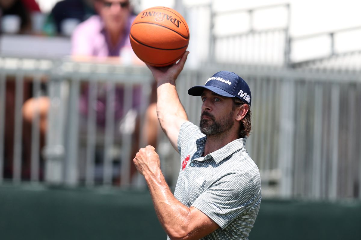 NFL athlete Aaron Rodgers shoots a basketball on the 17th hole during round two of the American Century Championship at Edgewood Tahoe South golf course on July 10, 2020 in South Lake Tahoe, Nevada.