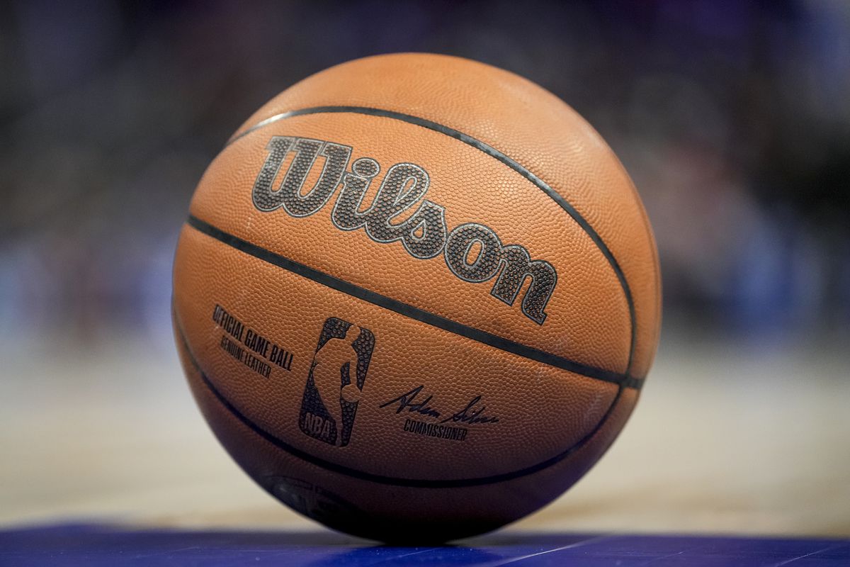 The NBA logo is pictured on a Wilson brand basketball during the game between the Detroit Pistons and Philadelphia 76ers Little Caesars Arena on March 31, 2022 in Detroit, Michigan.
