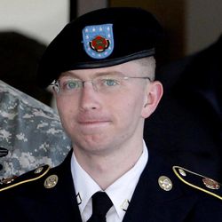 In this June 25, 2012 file photo, Army Pfc. Bradley Manning, right, is escorted out of a courthouse in Fort Meade, Md. The Army private charged in the largest leak of classified material in U.S. history says he sent the material to WikiLeaks to enlighten the public about American foreign and military policy on Thursday, Feb. 28, 2013.