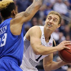 Brigham Young Cougars guard Chase Fischer (1) looks to get off a shot with Creighton Bluejays guard James Milliken (23) defending as BYU and Creighton play in NIT quarterfinal action at the Marriott Center in Provo Tuesday, March 22, 2016.