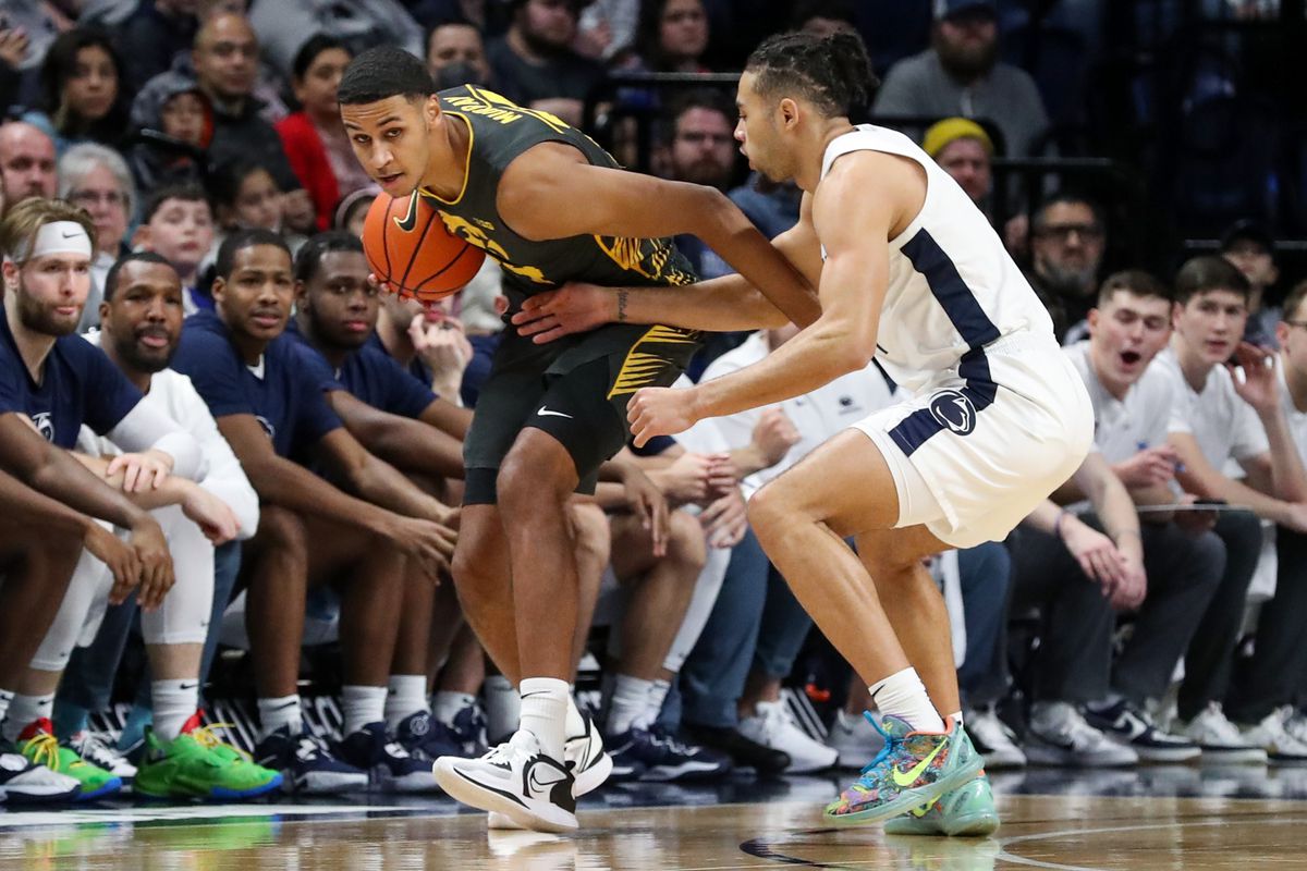 Jan 1, 2023; University Park, Pennsylvania, USA; Iowa Hawkeyes forward Kris Murray (24) holds onto the ball as Penn State Nittany Lions guard/forward Seth Lundy (1) defends during the first half at Bryce Jordan Center.