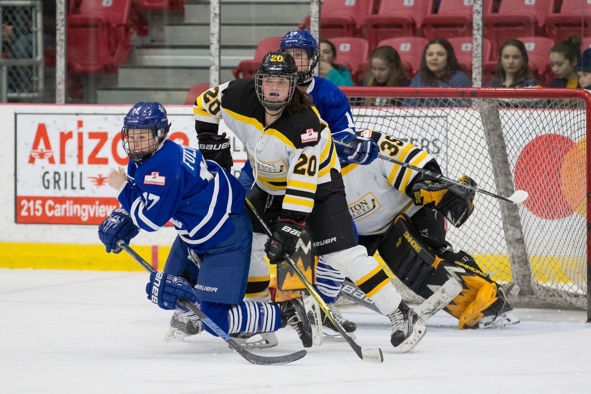 Emily Fulton (17) and Brittany Zuback (19) of the Toronto Furies battle with Meaghan Spurling (20) and Lauren Dahm (35) in front of the Boston net.