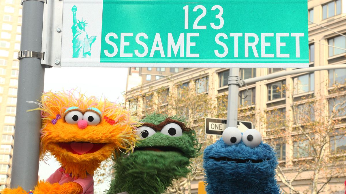 Sesame Street characters pose under a “123 Sesame Street” sign at the “Sesame Street” 40th Anniversary temporary street renaming in Dante Park on November 9, 2009, in New York City.
