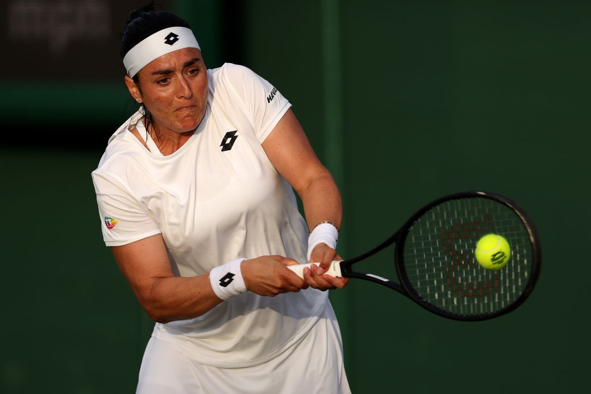 Ons Jabeur of Tunisia plays a backhand against Katarzyna Kawa of Poland during their Women’s Singles Second Round match on day three of The Championships Wimbledon 2022 at All England Lawn Tennis and Croquet Club on June 29, 2022 in London, England.