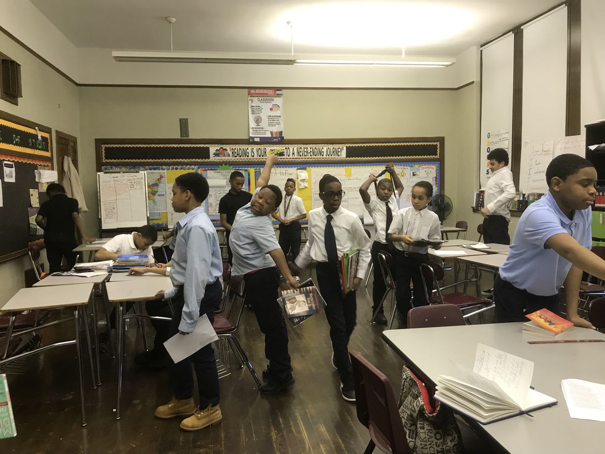 Students at Paul Robeson Malcolm X Academy get ready to switch classes on a recent day.