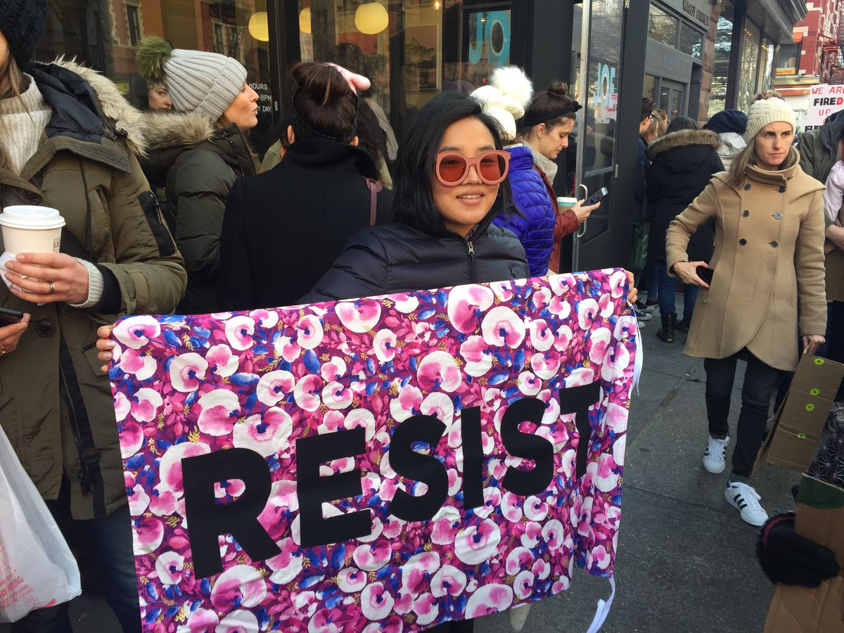 Eunice Kim with a banner from the Protest Banner Lending Library at the women’s march in New York City