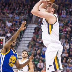 Utah forward Joe Ingles (2) shoots a 3-pointer over Golden State guard Ian Clark (21) during the first half of an NBA basketball game in Salt Lake City on Thursday, Dec. 8, 2016.