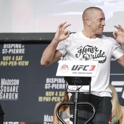 GSP poses at UFC 217 weigh-ins Friday.