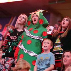 The crowd joins in for the 32nd annual Christmas Carol Sing-Along, hosted by the Larry H. Miller family, at the Vivint Smart Home Arena in Salt Lake City on Monday, Dec. 12, 2016.