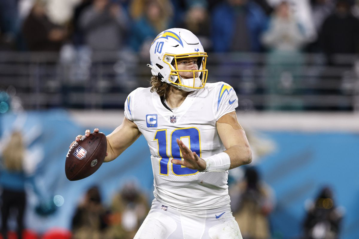 Quarterback Justin Herbert #10 of the Los Angeles Chargers on a pass play during the AFC Wild Card Playoffs game against the Jacksonville Jaguars at TIAA Bank Field on January 14, 2023 in Jacksonville, Florida. The Jaguars defeated the Chargers 31 to 30.