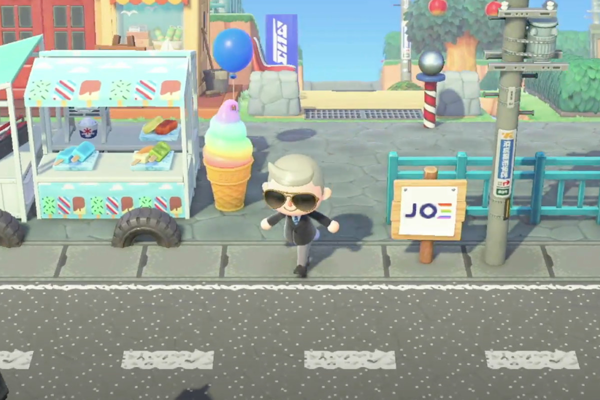 screenshot of Joe Biden’s Animal Crossing avatar on a streetscape including an ice cream truck and campaign signs