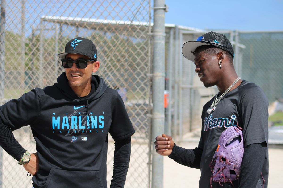 Marlins center fielder Jazz Chisholm Jr. talks to first base/outfield coach Jon Jay on the Roger Dean Chevrolet Stadium backfields during 2023 Spring Training