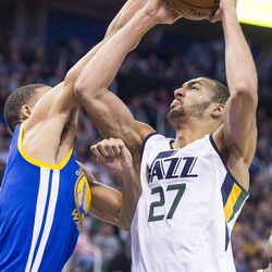Utah center Rudy Gobert (27) shoots over Golden State center JaVale McGee (1) during the first half of an NBA basketball game in Salt Lake City on Thursday, Dec. 8, 2016.