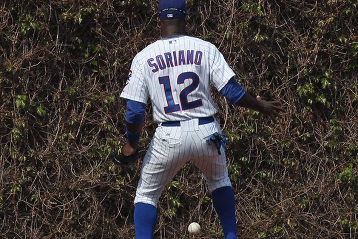 Help Alfonso find the ball: Alfonso Soriano of the Chicago Cubs watches as a fly ball hits the outfield wall against the St. Louis Cardinals at Wrigley Field in Chicago, Illinois. (Photo by Jonathan Daniel/Getty Images)