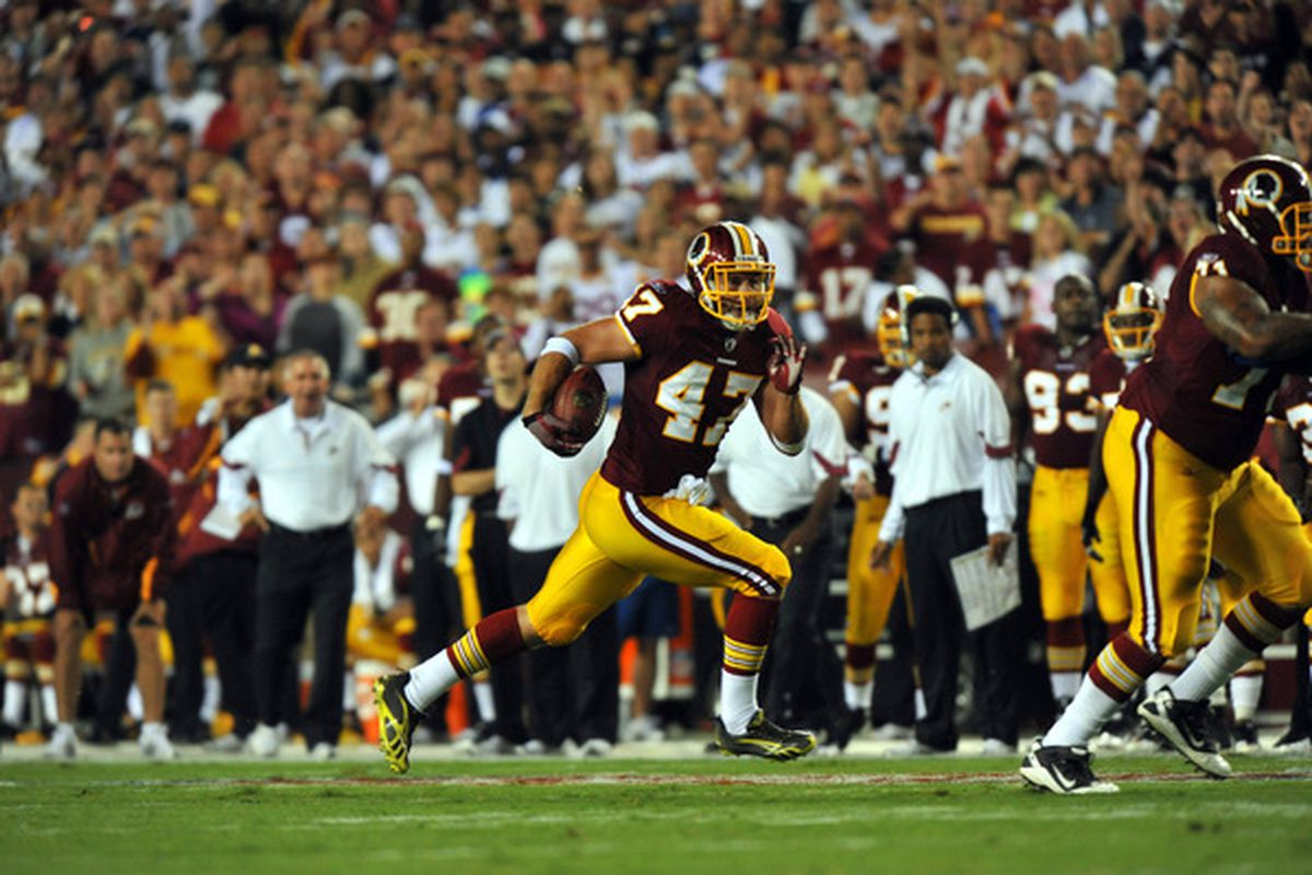 LANDOVER - SEPTEMBER 12:  Chris Cooley #47 of the Washington Redskins runs the ball during the NFL season opener against the Dallas Cowboys at FedExField on September 12 2010 in Landover Maryland.  (Photo by Larry French/Getty Images)