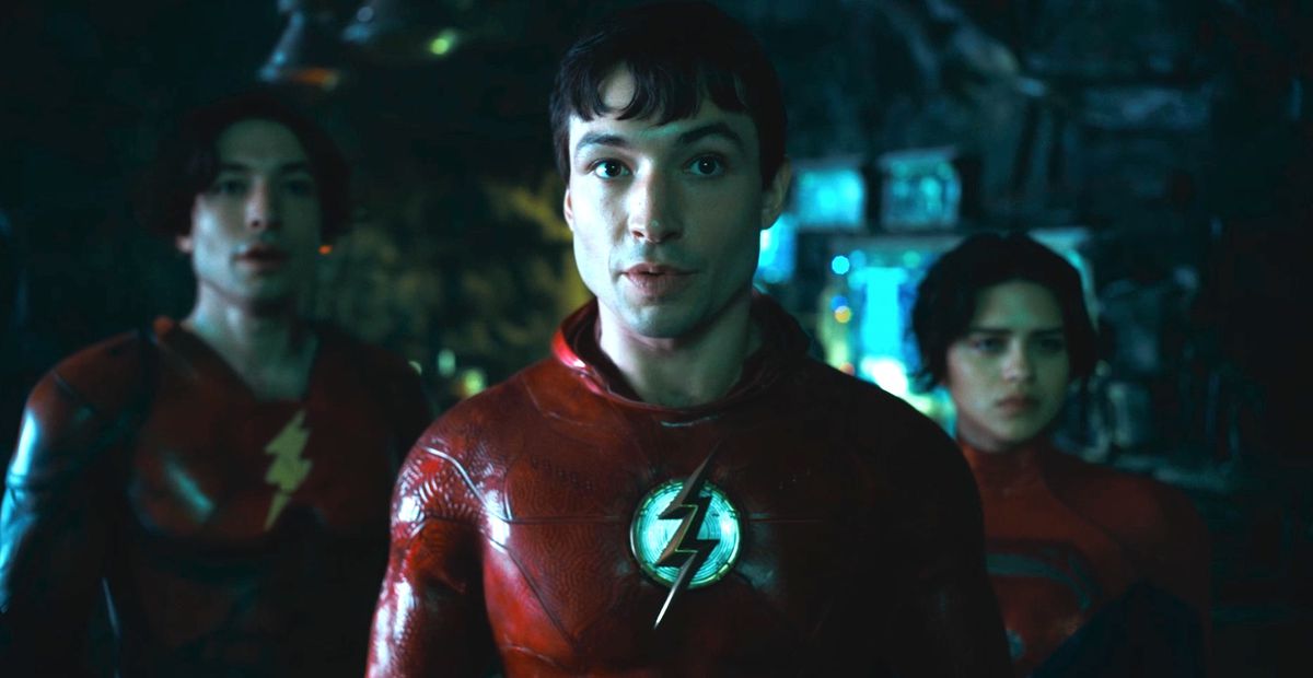 Ezra Miller as the 2D Flash and the new supergirl Sasha Kahler standing in the bat cave