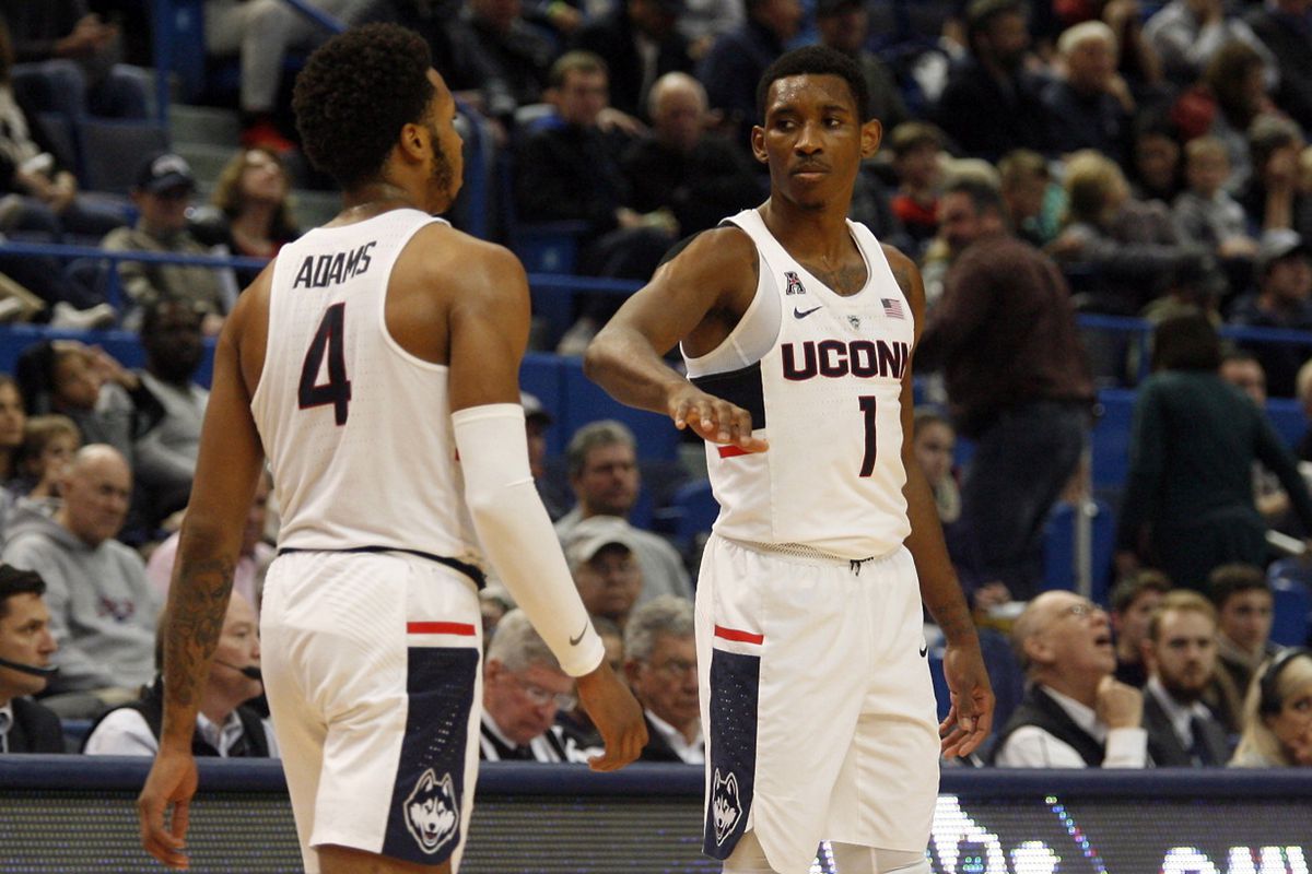 UConn's Christian Vital (1) and Jalen Adams (4) during the Monmouth Hawks vs UConn Huskies men's college basketball game at the XL Center in Hartford, CT on December 2, 2017.