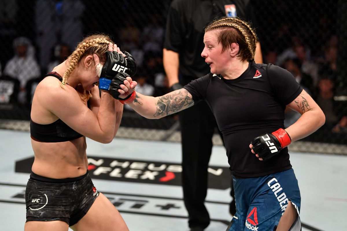 Joanne Calderwood of United Kingdom punches Andrea Lee in their women’s flyweight bout during UFC 242 at The Arena on September 7, 2019 in Yas Island, Abu Dhabi, United Arab Emirates.