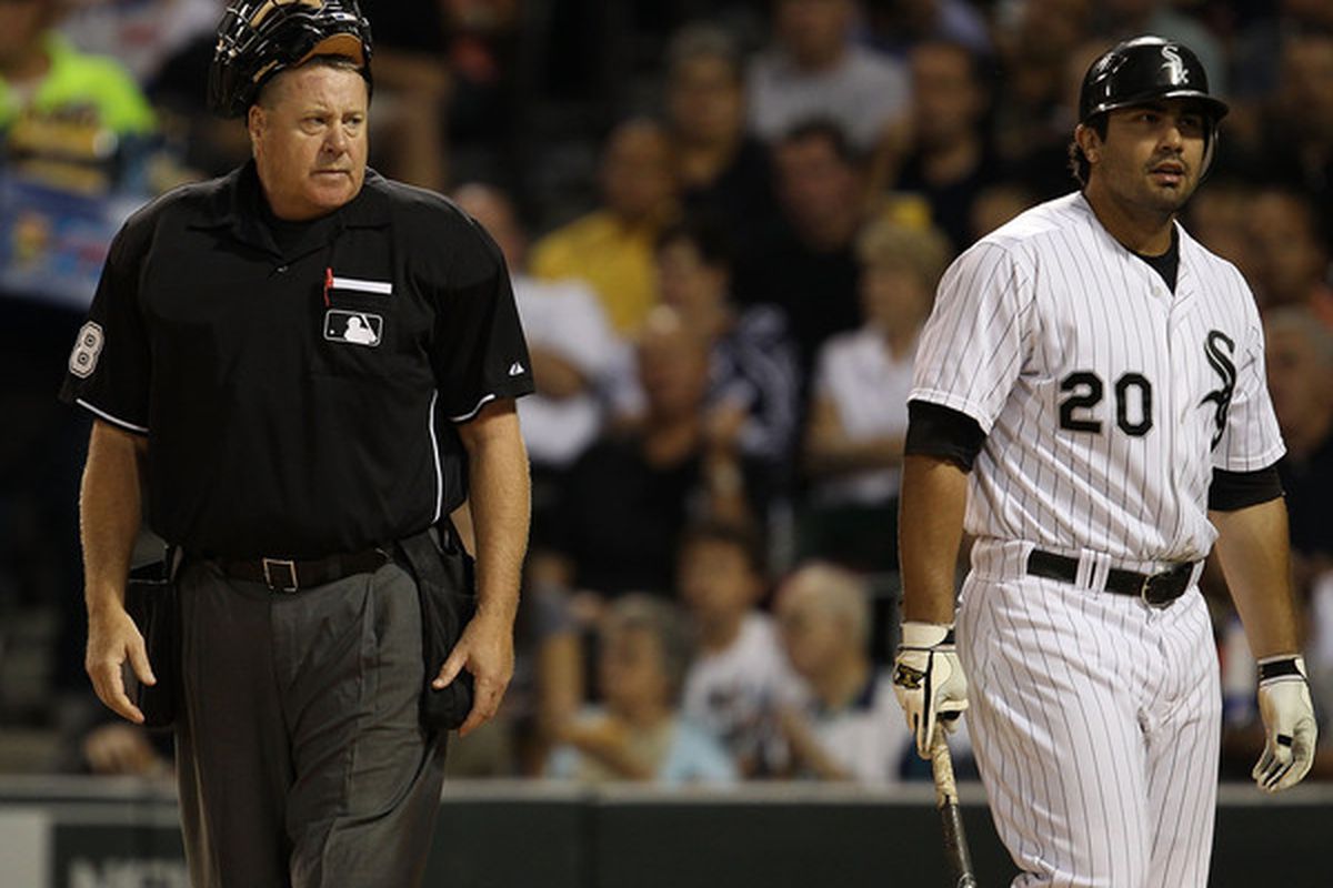 The photographer here undoubtedly sees the umpire as a stand-in for White Sox fans more generally.