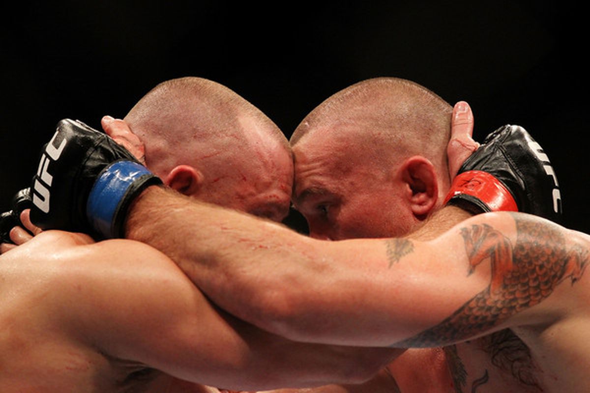 INDIANAPOLIS - SEPTEMBER 25:  (L-R) Matt Serra and Chris Lytle embrace at the end of their UFC welterweight bout at Conseco Fieldhouse on September 25 2010 in Indianapolis Indiana.  (Photo by Al Bello/Zuffa LLC via Getty Images)