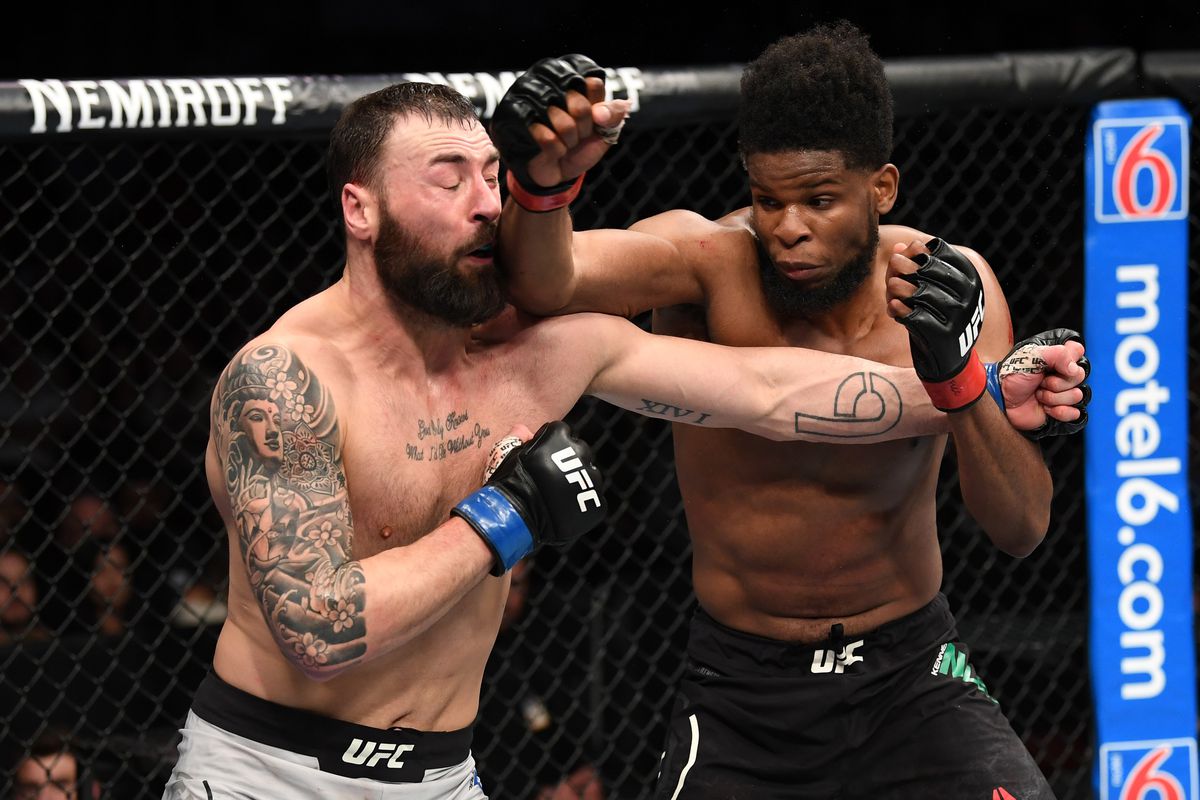 Kennedy Nzechukwu elbows the face of Paul Craig of Scotland in their light heavyweight bout during the UFC Fight Night event at Wells Fargo Center on March 30, 2019 in Philadelphia, Pennsylvania.