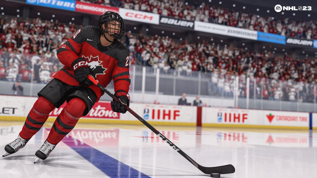 a screenshot of Sarah Nurse, #20, skating with the puck wearing the Canadian women’s national team’s red and black home jersey in NHL 23