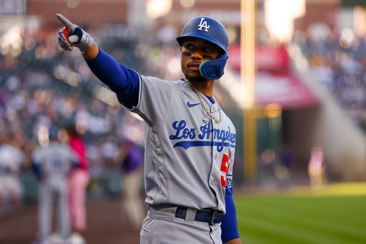 Mookie Betts #50 of the Los Angeles Dodgers points towards the stands before the first inning against the Colorado Rockies at Coors Field on April 9, 2022 in Denver, Colorado.