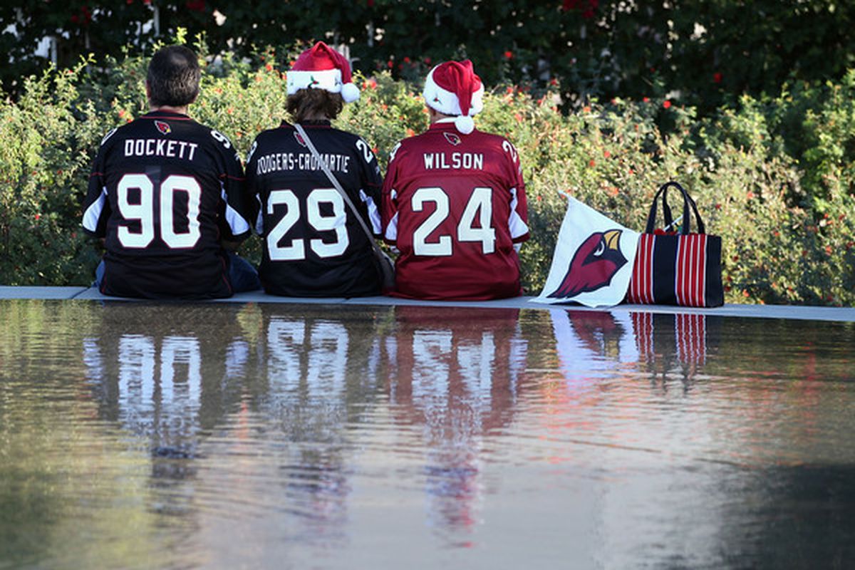 GLENDALE AZ - DECEMBER 25:  Fans of the Arizona Cardinals sit outside of the University of Phoenix Stadium before the NFL game against the Dallas Cowboys in Glendale Arizona.  (Photo by Christian Petersen/Getty Images)